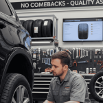 Mechanic inspecting a tyre in a workshop, checking valve, bead, torque, and tyre specifications — illustrating why tyres come back and how to avoid customer comebacks.